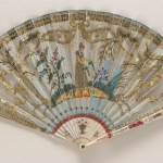 Folding fan of ivory sticks with a silk leaf embroidered with sequins and painted with a female figure watering plants. English, circa 1810. Fan Museum, Greenwich.