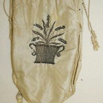 Simple and elegant reticule with lavender embroidered on one side and the lady's initial on the other surrounded by flowers, 1800-10 Metropolitan Museum of Art.