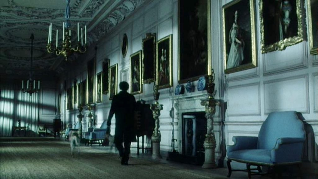 From the BBC/A&E 1995 mini-series Pride and Prejudice. Colin Firth as Mr. Darcy walks along the gallery at Pemberley.